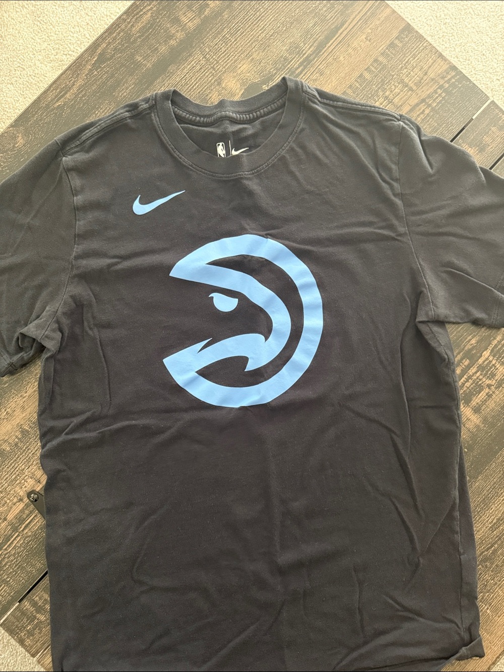 Nike NBA Black Tee with Light Blue Hawks Emblem
Men’s size medium